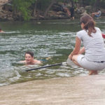Adam swimming in Austin river