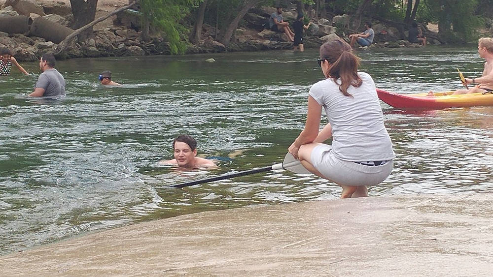 Adam swimming in Austin river