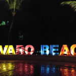Bavaro Beach sign at night